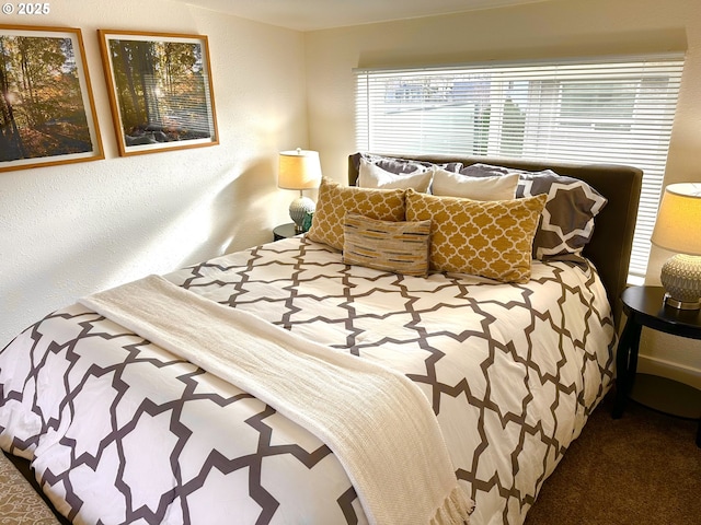 bedroom featuring a textured wall