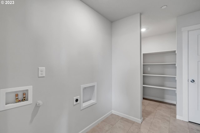 2609 S 7th Way, Ridgefield, WA 98642 - laundry area featuring electric dryer hookup, hookup for a washing machine, baseboards, and light tile patterned flooring