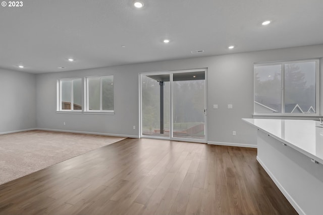 2609 S 7th Way, Ridgefield, WA 98642 - empty room with baseboards, plenty of natural light, recessed lighting, and wood finished floors