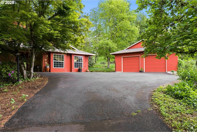 view of front of house with an outbuilding and a garage