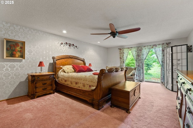 carpeted bedroom with wallpapered walls, access to outside, a textured ceiling, ceiling fan, and recessed lighting