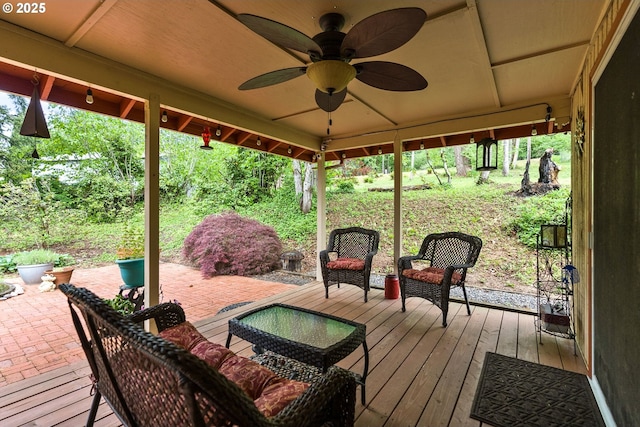 wooden terrace featuring ceiling fan and a patio area