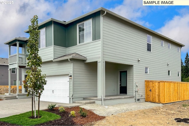 rear view of house with a garage