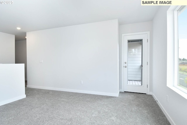 spare room with carpet floors