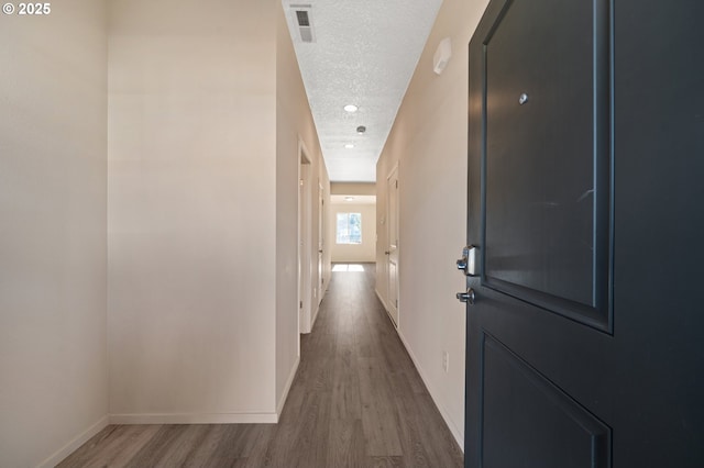 8512 NE 13th Pl, Vancouver, WA 98665 - hallway featuring wood finished floors and a textured ceiling
