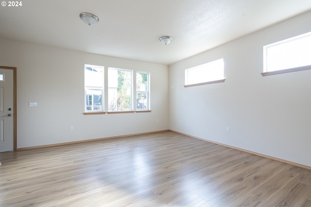 spare room featuring light hardwood / wood-style flooring