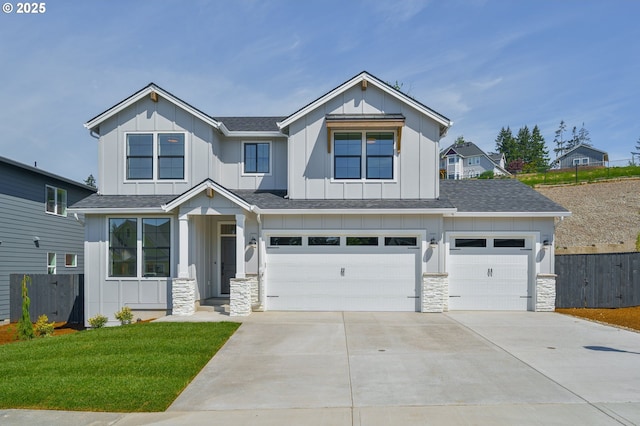 view of front of home featuring board and batten siding, concrete driveway, stone siding, and an attached garage