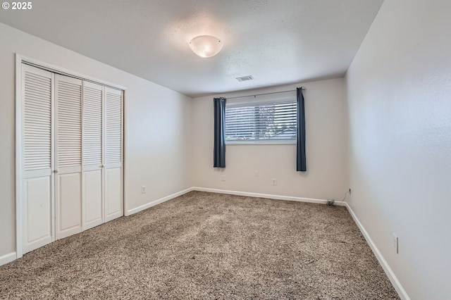 575 NE Fleming Ave Unit B-43, Gresham, OR 97030 - unfurnished bedroom featuring carpet floors, baseboards, and a closet