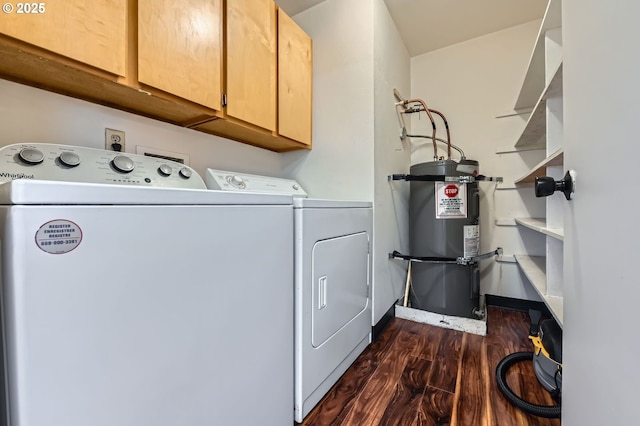 575 NE Fleming Ave Unit B-43, Gresham, OR 97030 - laundry area with secured water heater, cabinet space, washing machine and clothes dryer, and dark wood-type flooring