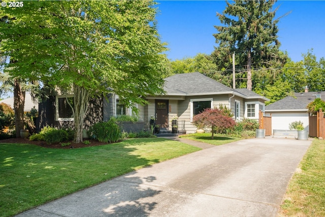 7414 N Chautauqua Blvd, Portland, OR 97217 - view of front of property featuring a front yard, a garage, an outbuilding, and concrete driveway
