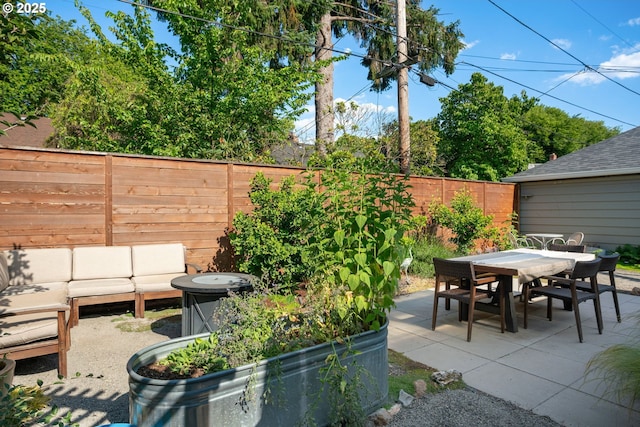 7414 N Chautauqua Blvd, Portland, OR 97217 - fenced backyard with a patio area, outdoor dining area, and an outdoor living space