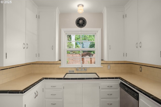 7414 N Chautauqua Blvd, Portland, OR 97217 - kitchen with stainless steel dishwasher, backsplash, and white cabinets