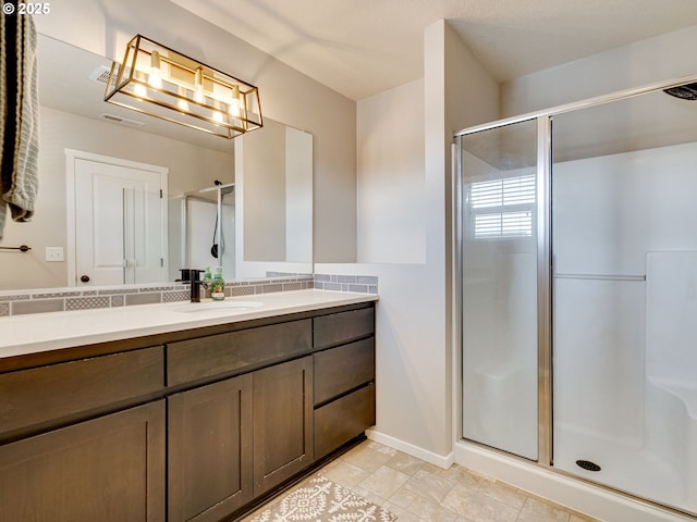 11411 NE 131st Pl, Vancouver, WA 98682 - bathroom featuring vanity, visible vents, baseboards, and a stall shower