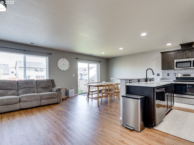 11411 NE 131st Pl, Vancouver, WA 98682 - kitchen with visible vents, light wood-style flooring, and stainless steel appliances