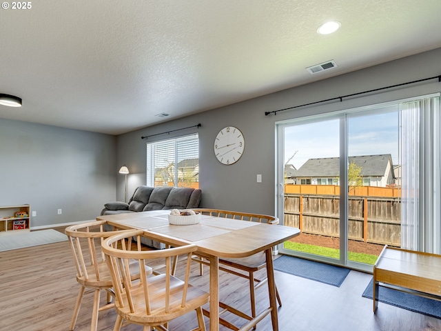 11411 NE 131st Pl, Vancouver, WA 98682 - dining space featuring visible vents, baseboards, light wood-type flooring, and a textured ceiling