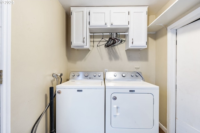 laundry area featuring cabinet space and washing machine and dryer