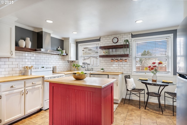 kitchen featuring wooden counters, open shelves, wall chimney range hood, and white appliances