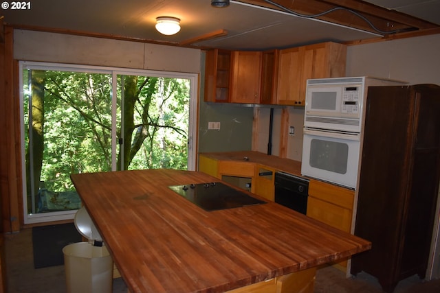 4911 SW Garden Home Rd, Portland, OR 97219 - kitchen featuring butcher block counters, white appliances, a kitchen island, and brown cabinets