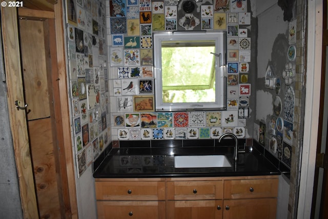 4911 SW Garden Home Rd, Portland, OR 97219 - kitchen featuring dark countertops and a sink