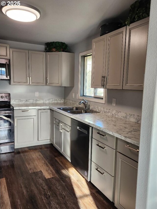 kitchen featuring sink, dark hardwood / wood-style floors, and appliances with stainless steel finishes