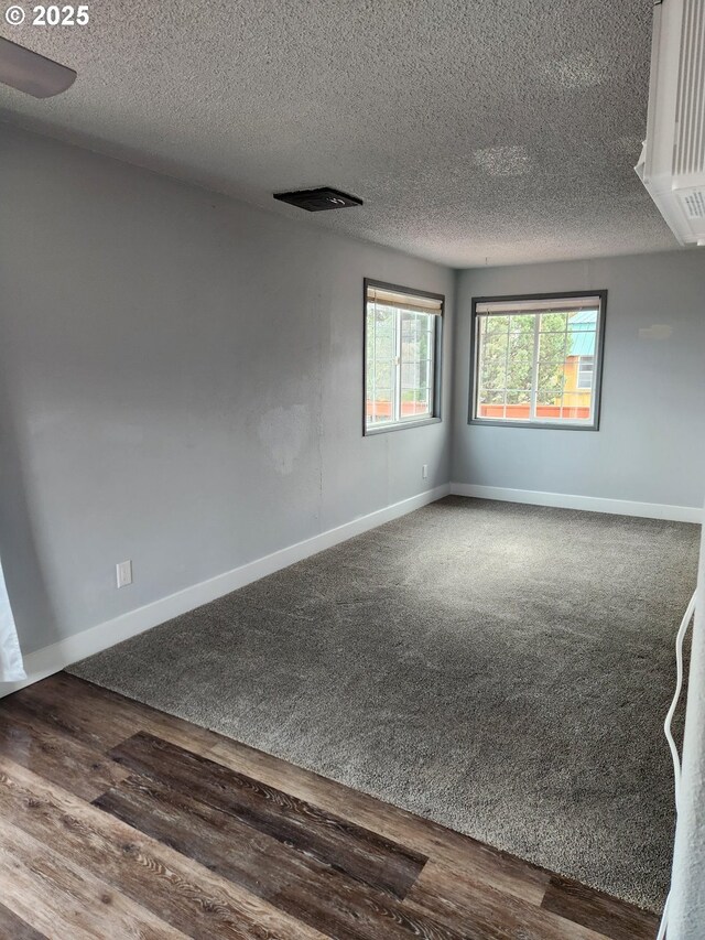 bedroom featuring light wood-type flooring, a textured ceiling, and ceiling fan