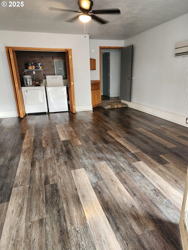 washroom featuring washing machine and dryer and dark hardwood / wood-style floors