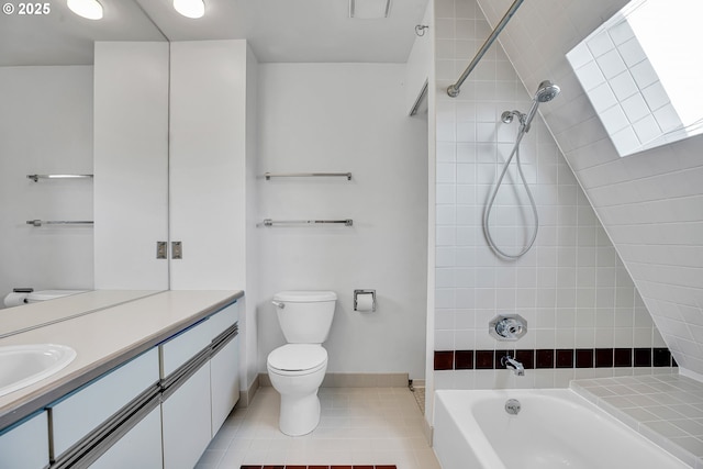 bathroom with tile patterned flooring, baseboards, shower / washtub combination, toilet, and vanity