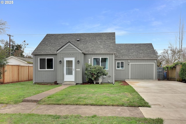 view of front facade with a front lawn and a garage