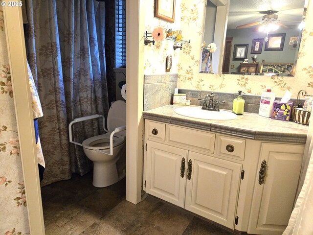 215 NE 9th St, Oakland, OR 97462 - bathroom with toilet, vanity, tile patterned flooring, and curtained shower