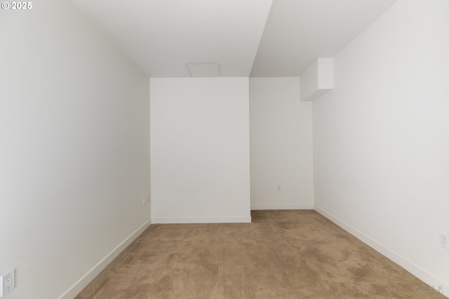 unfurnished room with light carpet