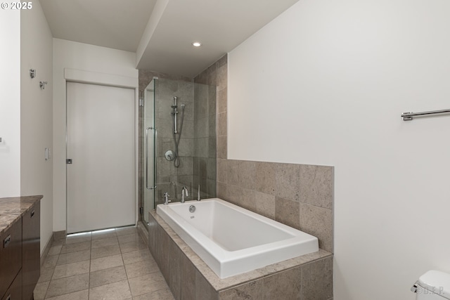 full bathroom featuring vanity, toilet, tile patterned floors, and plus walk in shower