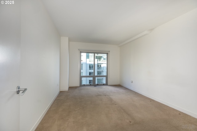 empty room with light colored carpet