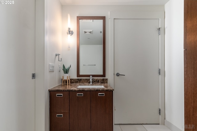 bathroom featuring vanity and tile patterned flooring