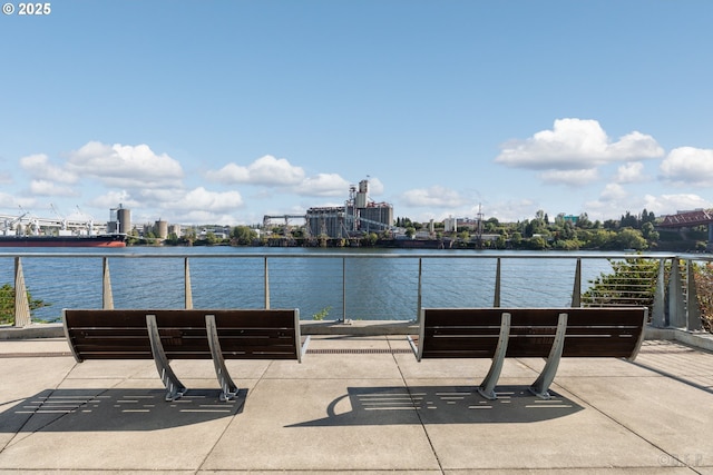 view of patio featuring a water view