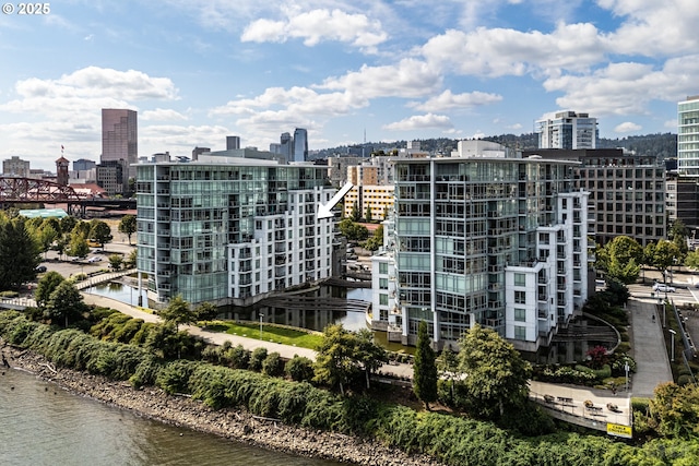 property's view of city featuring a water view