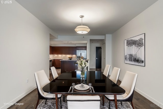 dining space featuring dark hardwood / wood-style floors