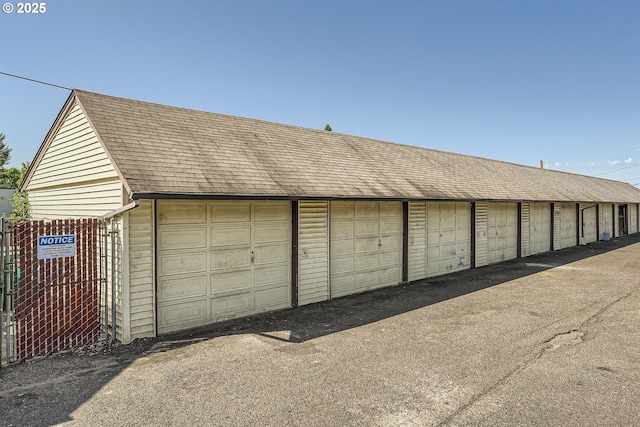 garage featuring fence