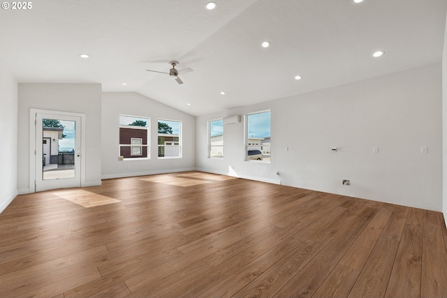 30403 Sawyer Way, Gold Beach, OR 97444 - unfurnished living room with ceiling fan, lofted ceiling, wood finished floors, recessed lighting, and a wall unit AC