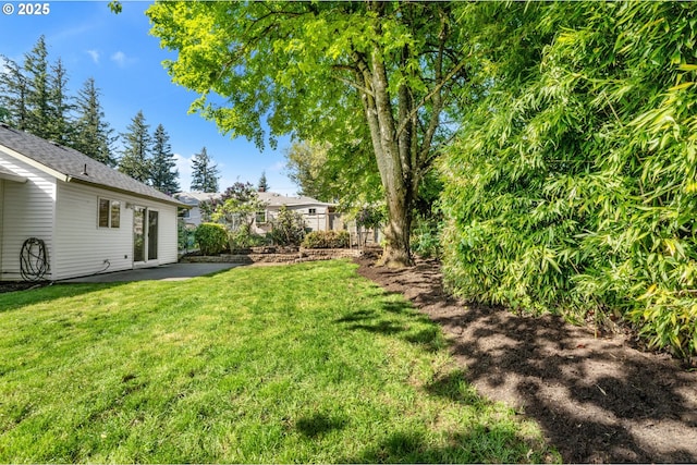 view of yard with a patio and fence