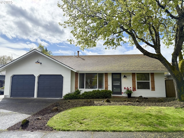ranch-style home featuring roof with shingles, driveway, a front lawn, a garage, and fence