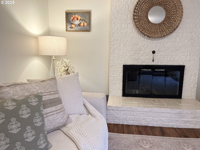 room details with a fireplace and wood finished floors