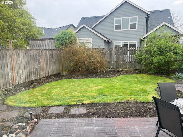 view of yard with a patio area and fence