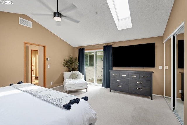 3138 Kentwood Dr, Eugene, OR 97401 - bedroom with vaulted ceiling, light colored carpet, a skylight, baseboards, and a closet