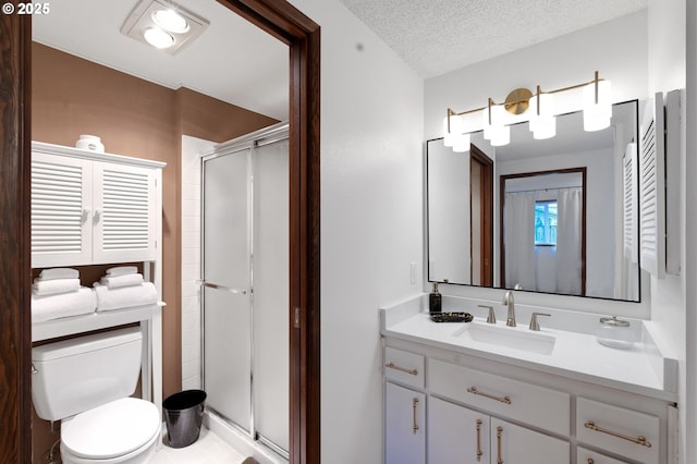 3138 Kentwood Dr, Eugene, OR 97401 - bathroom featuring a stall shower, toilet, vanity, and a textured ceiling