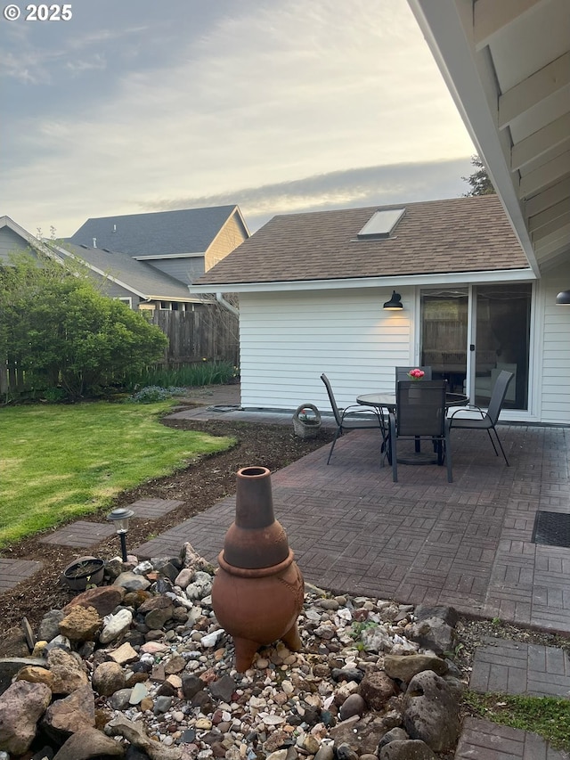 view of patio featuring fence