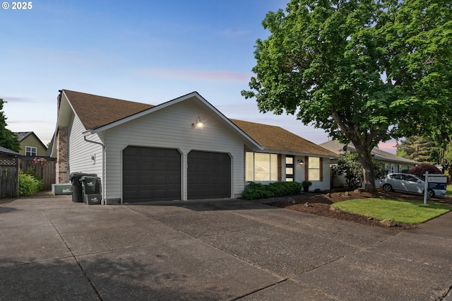 3138 Kentwood Dr, Eugene, OR 97401 - ranch-style house with an attached garage, driveway, and roof with shingles