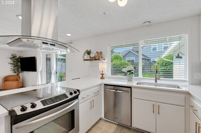 3138 Kentwood Dr, Eugene, OR 97401 - kitchen with stainless steel appliances, island exhaust hood, a sink, open shelves, and a textured ceiling