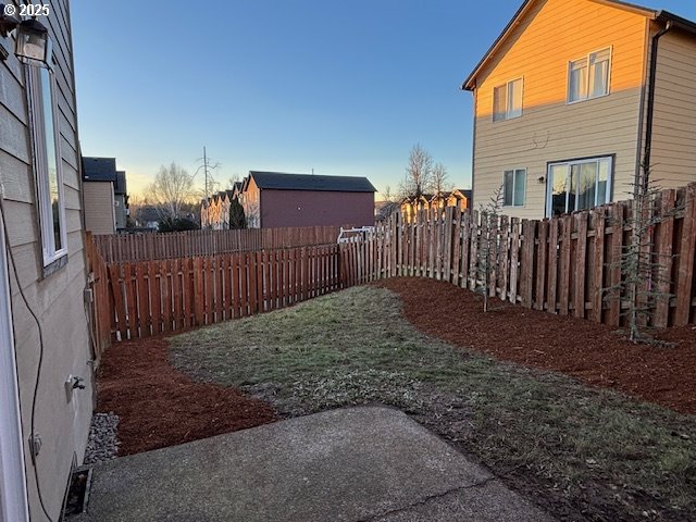 view of side of property with a lawn