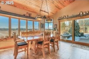 52995 Riverview Dr, La Pine, OR 97739 - dining room with wood ceiling, lofted ceiling, stone tile floors, and a chandelier