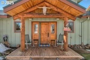 52995 Riverview Dr, La Pine, OR 97739 - entrance to property with board and batten siding